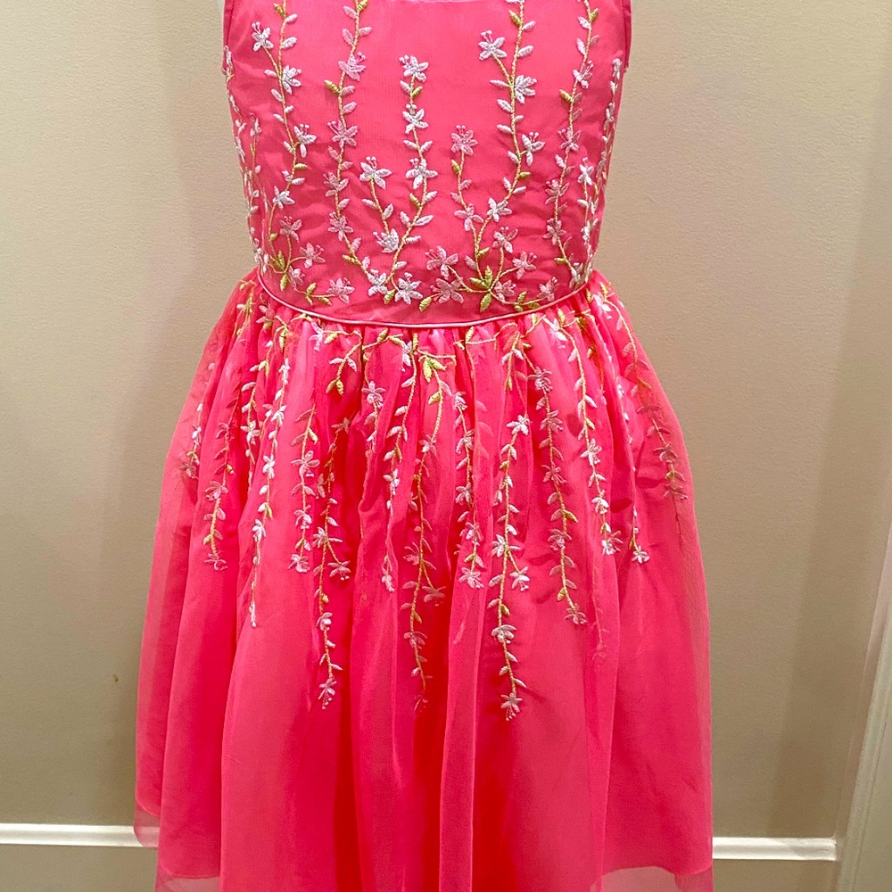 A pink dress with vines